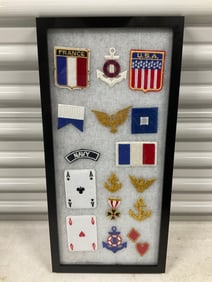 lot of military and other patches in shadow box 21 x 10