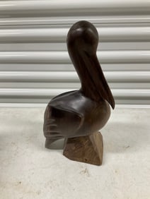 Iron wooden hand carved pelican statue