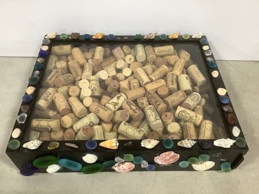 Shell themed shadow box full of corks