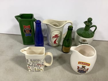 Various pitchers(Smirnoff, Tullamore Dew(8.5in.tall), etc.) and glass bottles