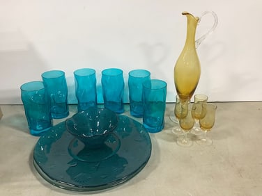 Blue glass cups, bowl, and more(14.5in.tallest)