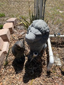 Plastic lion and owl statues