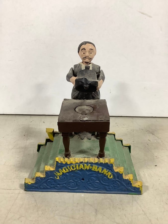 Vintage cast iron Magician bank(7.5in.tall): Vintage cast iron Magician bank(7.5in.tall)
