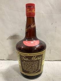 Tia Maria jamaican liqueur(55 proof, 26 2/3 fl.oz.-bottle half full)