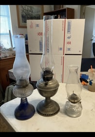 set of 3 oil lamps, tallest is 23"