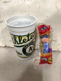 Oakland Athletics cup and Peanuts PEZ dispenser
