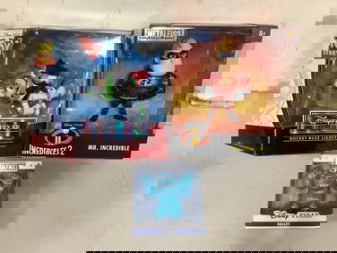 Disney Pixar diecast collectibles(Mr.Incredible, Sulley) and Rocket Buzz Lightyear