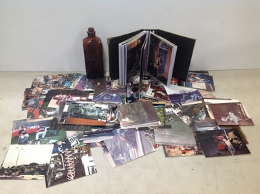 Vintage scrapbook, photographs, and glass medicine bottle(7in.tall)