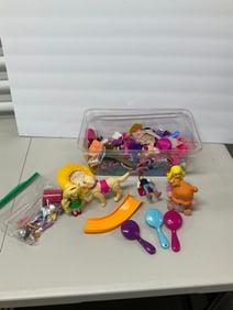 lot of barbie figurines and accessories