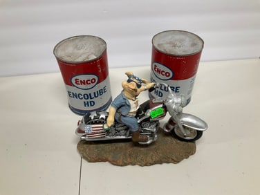 Lot of oil cans and pig statue