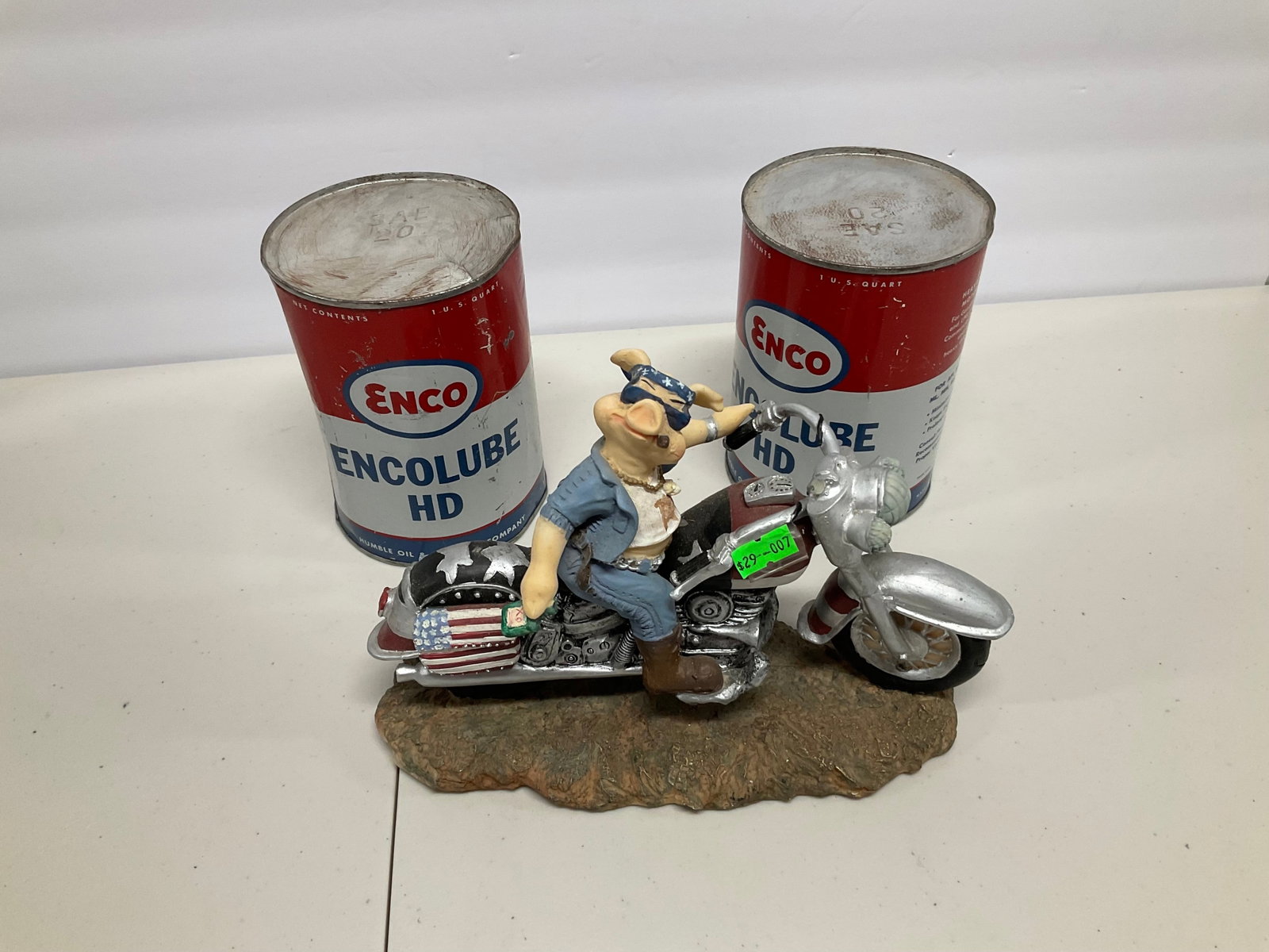 Lot of oil cans and pig statue: Lot of oil cans and pig statue