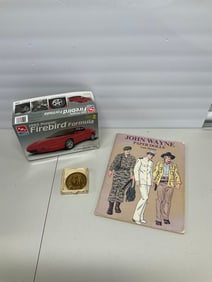 Lot of bicentennial coin, John Wayne book and Firebird kit