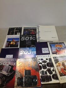 1989 Sybase transact SQL users guide and vintage Hasselblad camera and lens brochures/catalogs