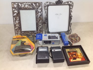 Empty photo frames, vintage radios, Kodak Advantix camera(new in package), and more