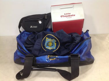 Cabela's outdoor gear bag, North Brunswick police duffle bag, and Little Playmate cooler