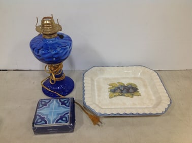 Art deco blue glass lamp(11in.tall), Santorini coasters, and decorative plate