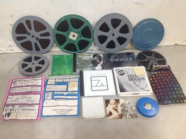 Vintage film reels and various DVD's