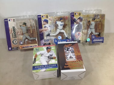 Collectible McFarlane baseball figures(Jason Giambi, Eric Gagne), Sammy Sosa bobblehead doll, and