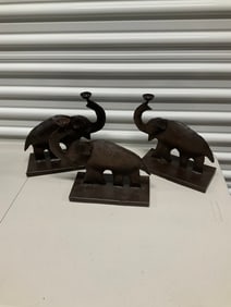 Lot of 3 cast iron elephant candle holders