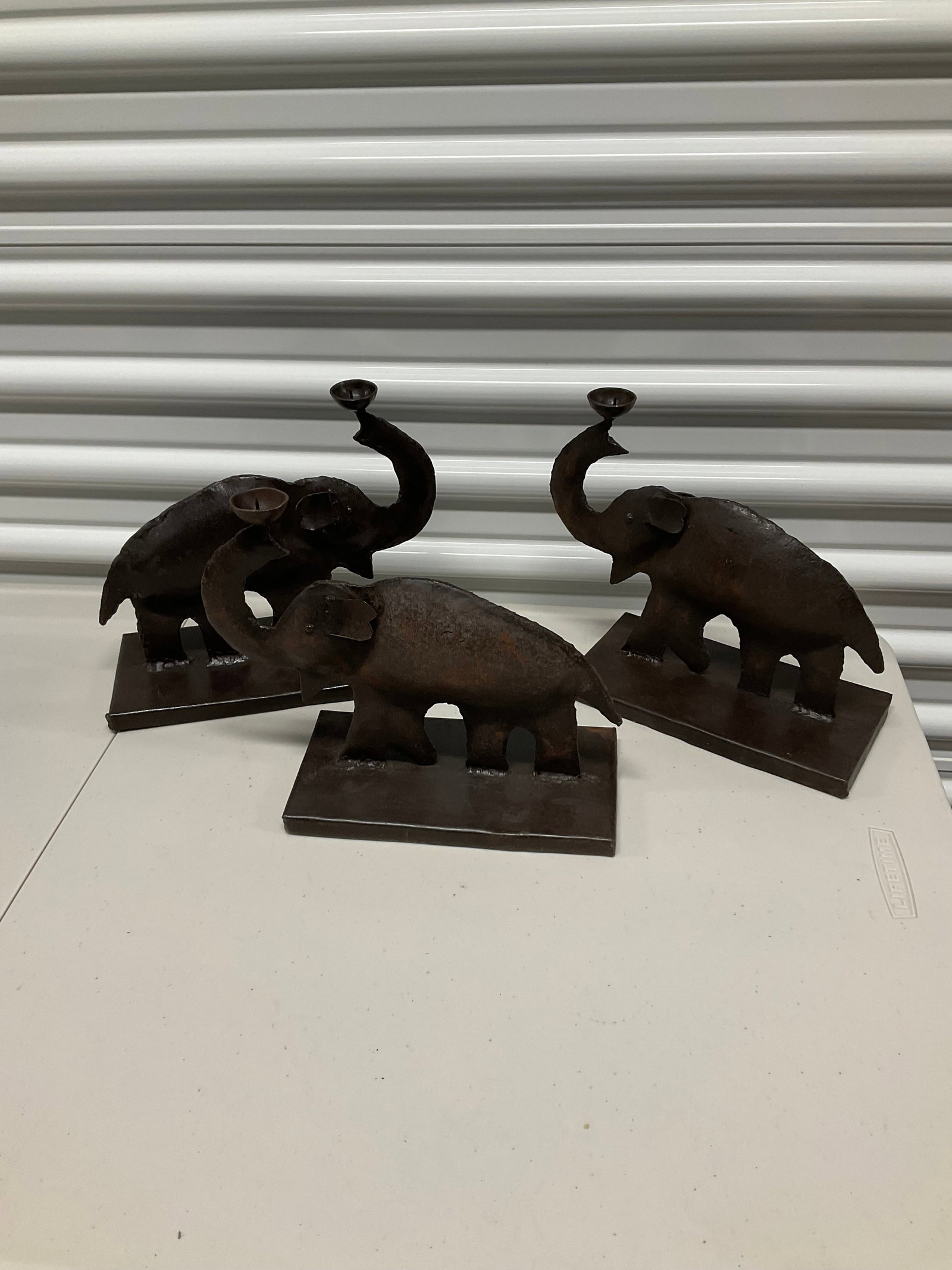 Lot of 3 cast iron elephant candle holders: Lot of 3 cast iron elephant candle holders