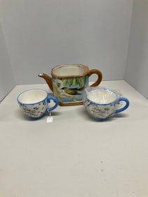 Tea pot and two tea cups