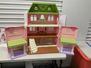 large doll house without any furniture