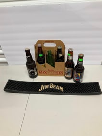Lot of vintage beer bottles, and bar mat
