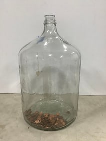 Glass jug with coins(21in.tall)