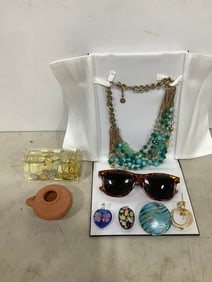 Sunglasses, Fortunoff necklace, clay oil lamp, and more