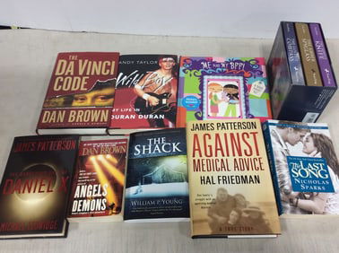 Various books(The DaVinci Code, Against Medical Advice, The Last Song, and more)