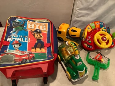 Paw Patrol suitcase and various children's toys