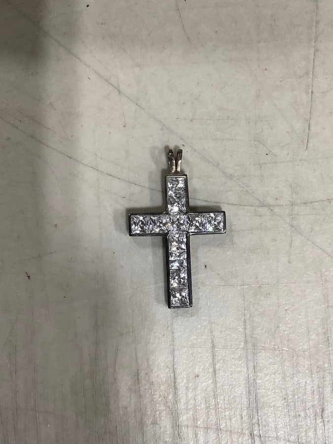 Sterling silver loaded with clear stone cross: Sterling silver loaded with clear stone cross