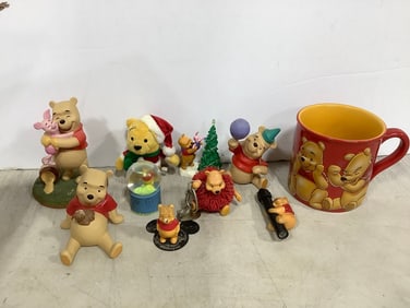 Winnie the Pooh lot(mug, snowglobe, and various statues-tallest 5in.)