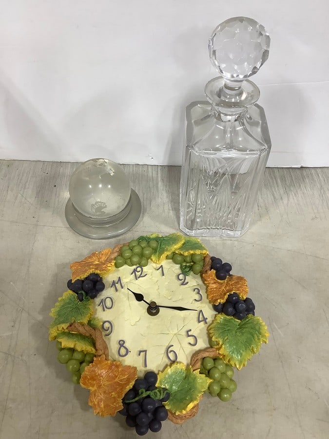 Glass decanter(10.5in.tall), Quartz wall hanging clock, and globe paperweight (1 of 1)