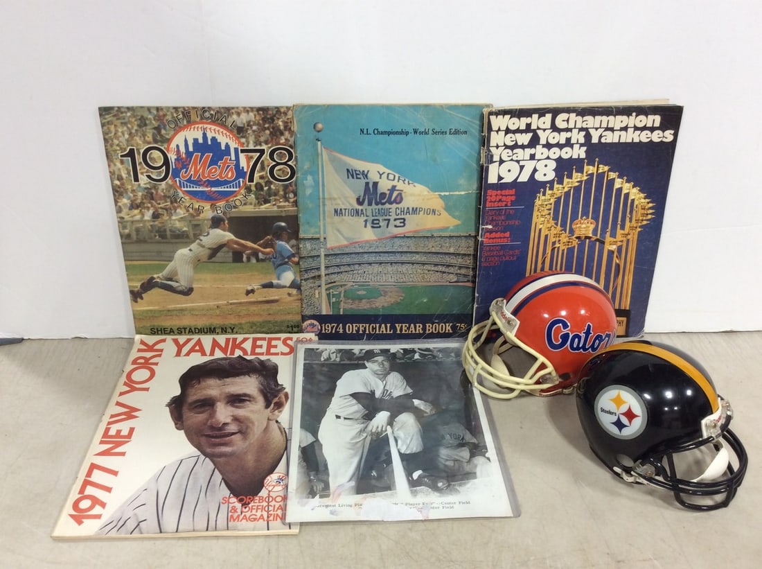 Miniature football collectible helmets and sports yearbooks: Miniature football collectible helmets and sports yearbooks