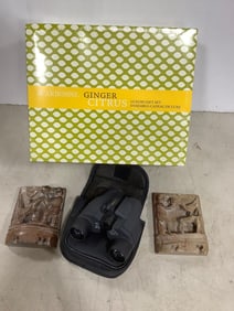 Barska binoculars, Arbonne ginger citrus luxury gift set, and carved sculptures