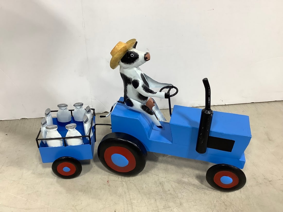 Vintage cow pulling milk wagon: Vintage cow pulling milk wagon