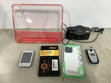 Verizon flip phone, Canon camera, Sharper Image MP4 player,