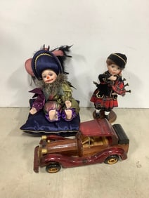 Vintage wooden toy car and ceramic dolls
