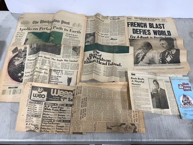 Vintage newspapers and Walt Disney brochure