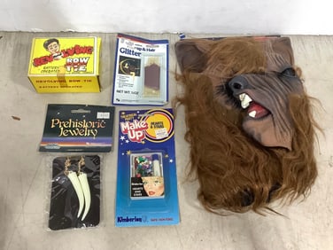 Vintage halloween mask, prehistoric costume jewelry, theatrical party makeup, and more