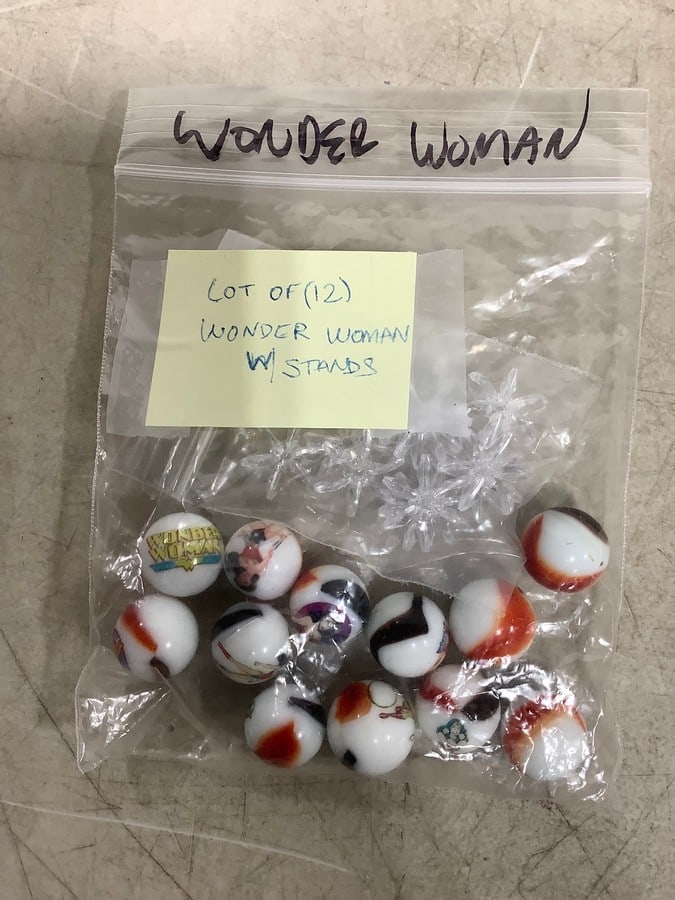 Lot of Wonder Woman marbles with stands: Lot of Wonder Woman marbles with stands