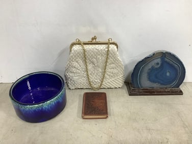 Geode decor, vintage women's handbag, pottery bowl, and more