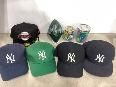 NY Yankees hats, bouncy balls, and NY Jets football