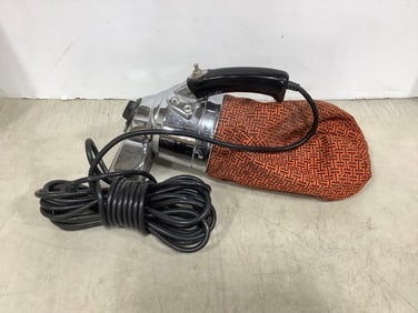 Vintage handheld corded vacuum