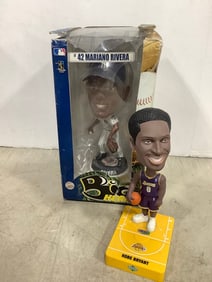 Mariano Rivera collectible in box and Kobe Bryant bobble head