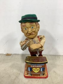 Vintage Charley Weaver bartender tin toy