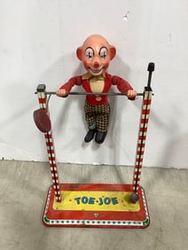 Vintage Toe Joe tin toy
