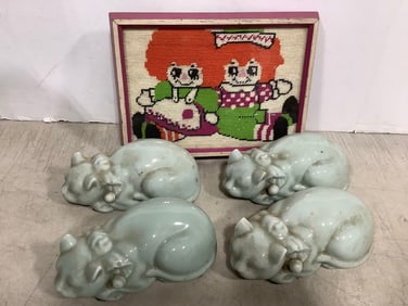Ceramic cats and framed needlepoint artwork(8.5in.x11.5in.)