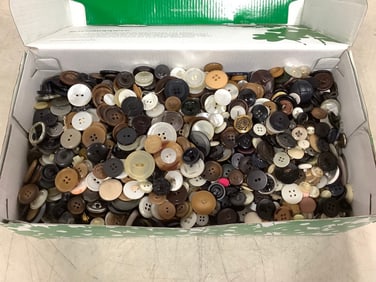 Vintage shoebox of buttons